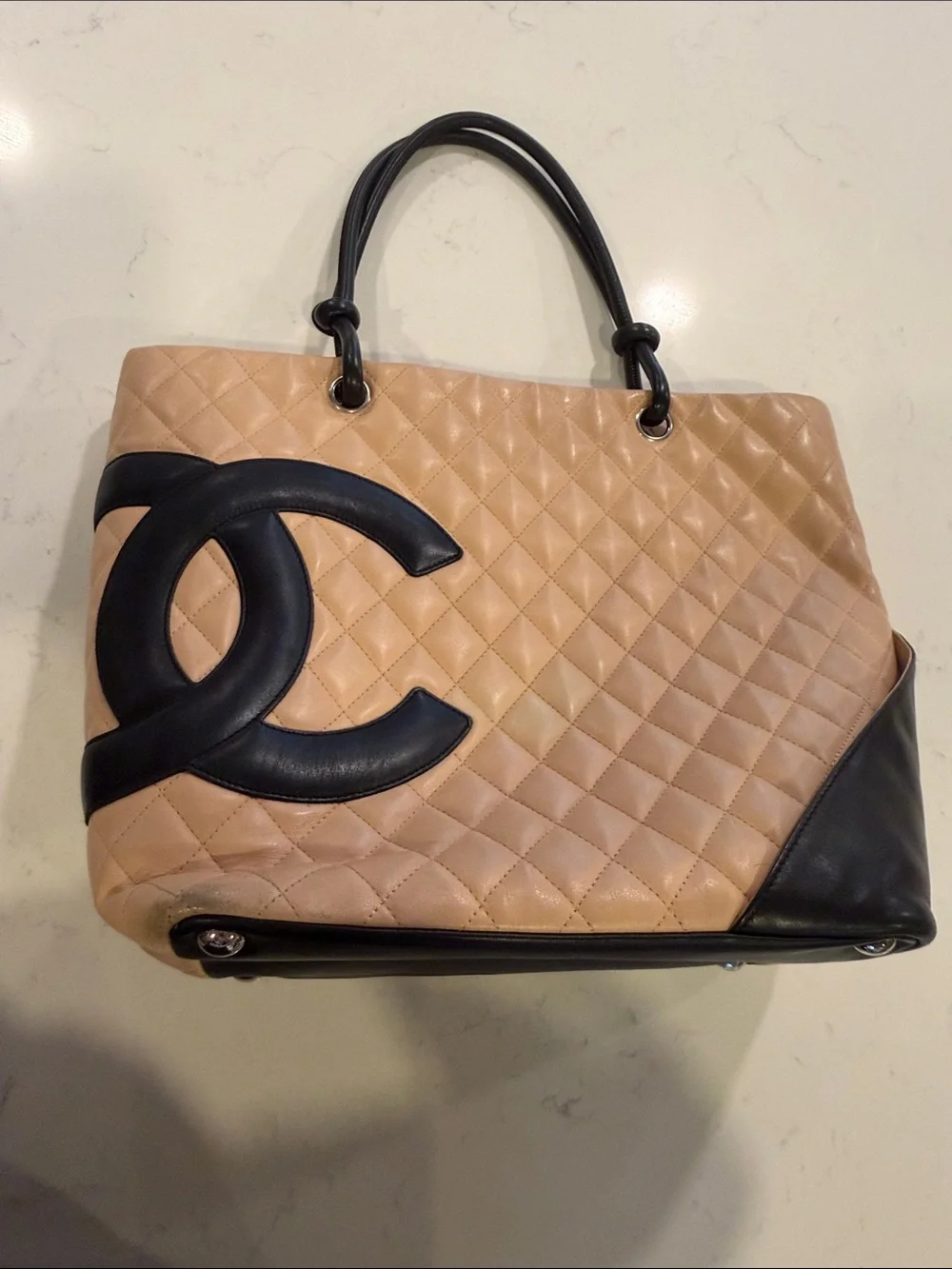 CHANEL Beige Quilted Tote with Black Accents